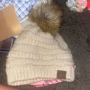 beige CC beanie w pom pom